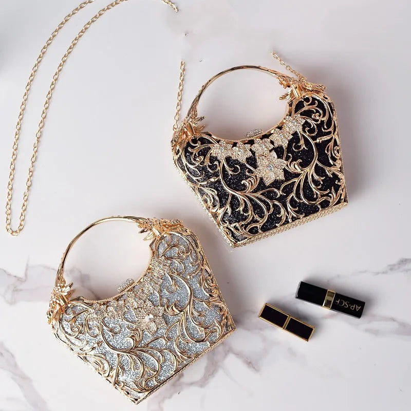 Silver hollow-out party clutch with shiny finish, flower motif, and bucket shape on a plain background