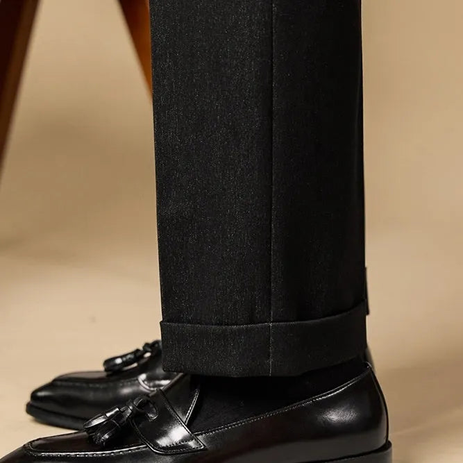 Men's black and brown polished leather tassel loafers with pigskin lining and rubber soles