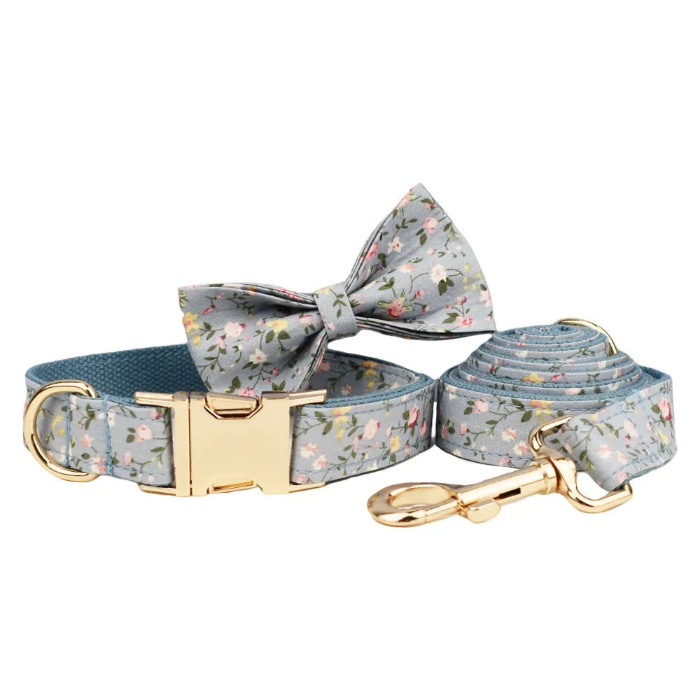 Floral pattern dog collar set with leash, vest, bow, and poop bag holder in five coordinated pieces