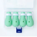Four green silicone cat anti-scratch foot covers for paw protection during washing and handling