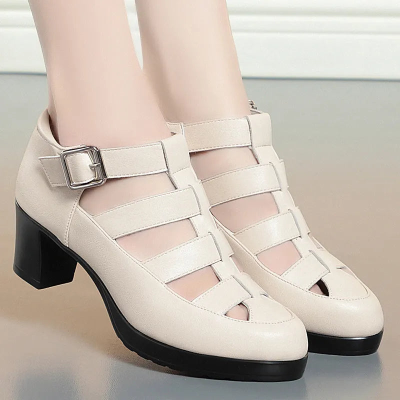 Women's beige closed toe sandals with chunky heel, ankle strap, buckle, and back zipper.