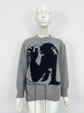Grey women's loose alpaca wool sweater with tassel detail and abstract pattern, round neck.