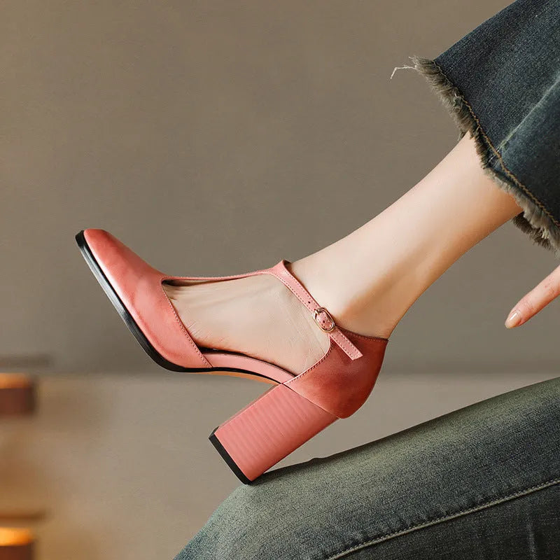 Women's pink retro Mary Jane shoes with a pointed toe, buckle strap, and cowhide leather upper.