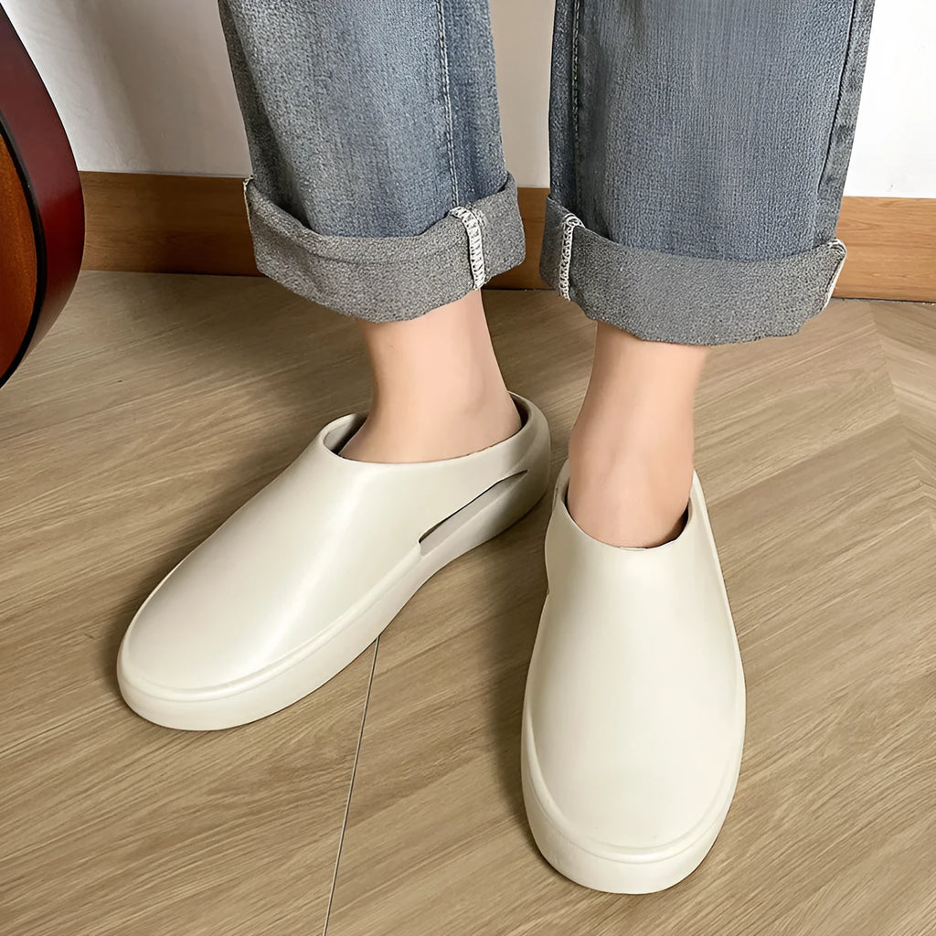 Men's closed toe non-slip EVA slippers in beige, side view, with textured sole
