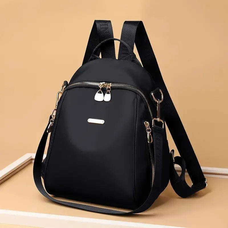 Women's Oxford cloth casual travel backpack in urban simplicity style with sewing line detail and sandwich pocket