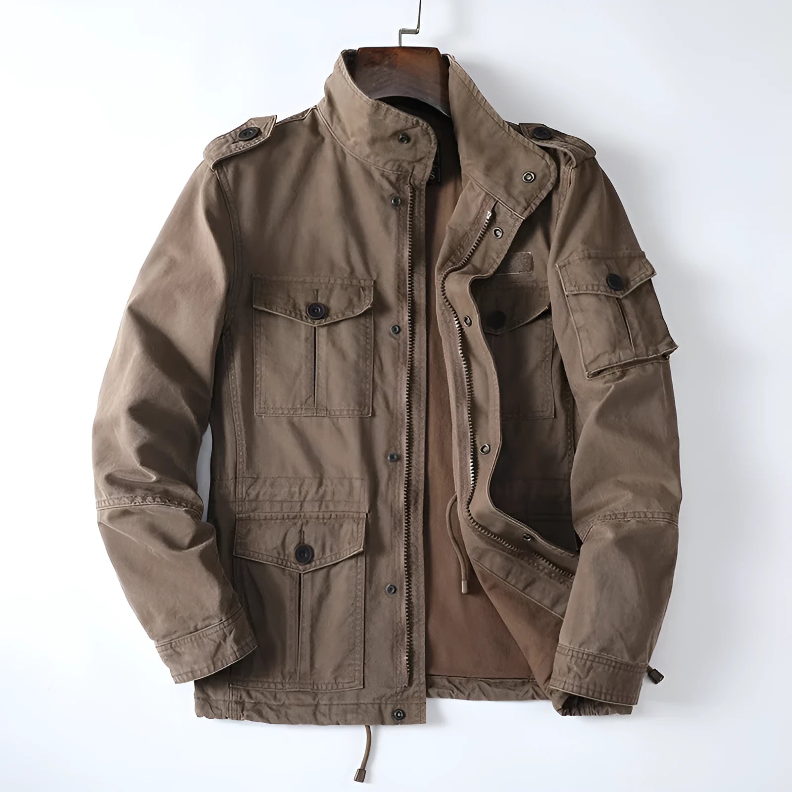 Man wearing a light brown loose-fit cotton zip-up jacket, retro casual style.