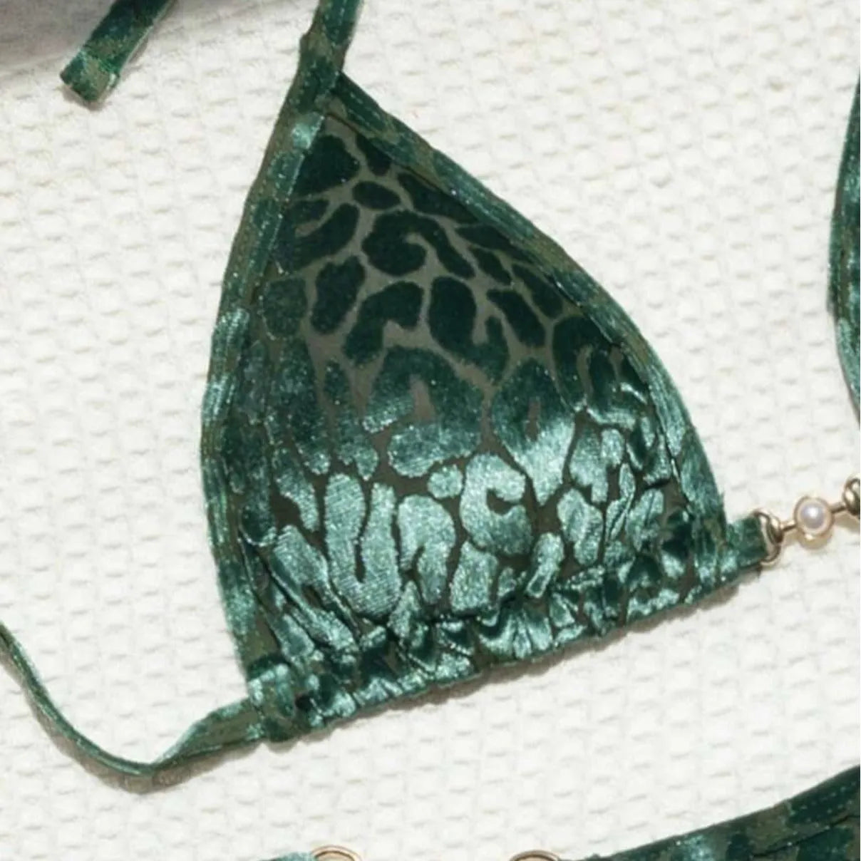 Women's blue leopard print T-shaped bikini swimsuit made from polyester and spandex fabric.