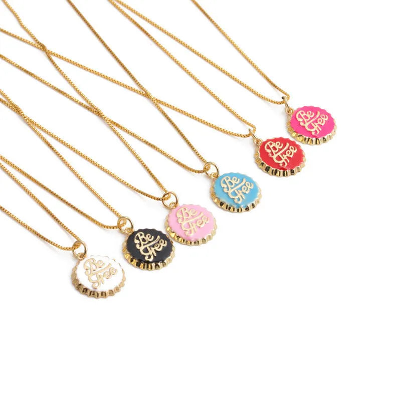 Copper bottle cap pendant necklace on a 40cm box chain with an 18K gold electroplated finish.