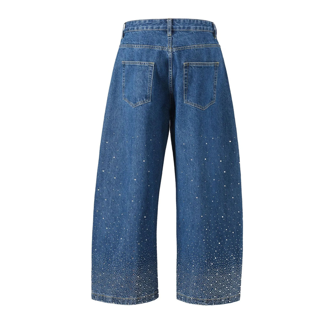 Blue loose-fitting cotton wide-leg trousers on a hanger, showing straight cut and regular sleeve style