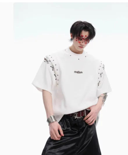 Short sleeve black top with a white lace-up cutout detail on the front, deconstruction style.