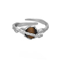 Silver Saturn planetary motif open ring with adjustable size and white gold electroplated finish