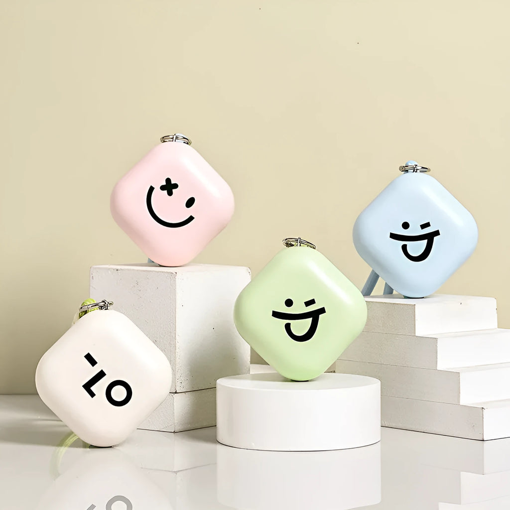 Square rechargeable hand warmer in white, light green, and pink colours with USB charging