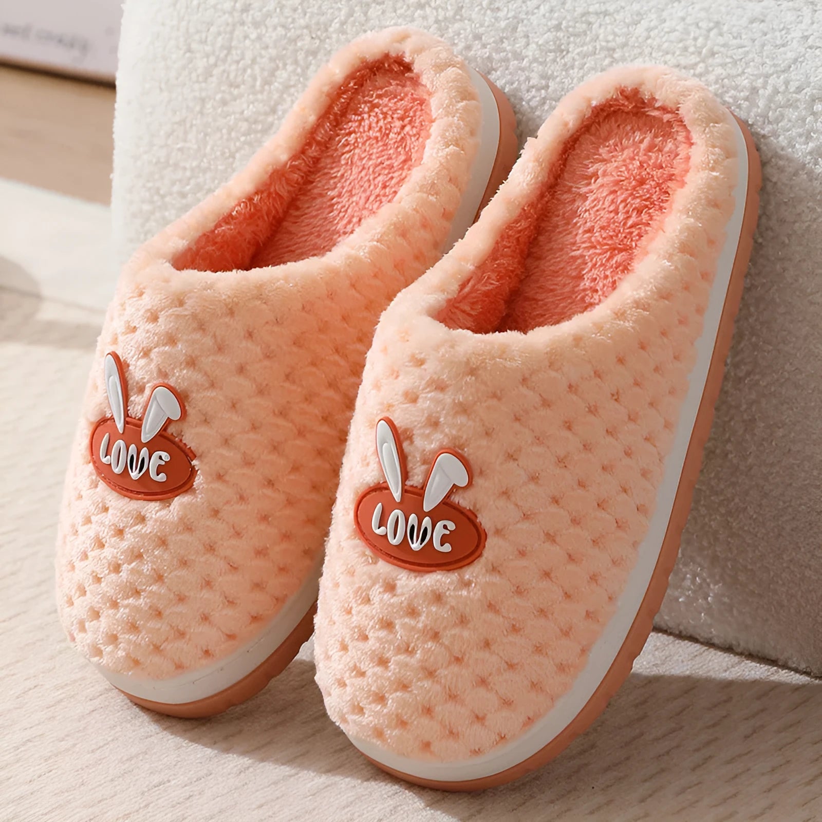 Rabbit plaid pattern women's house slippers with artificial fur upper and rubber sole.