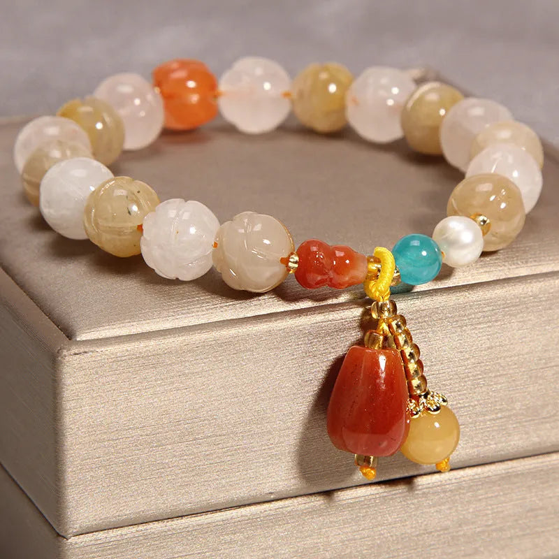Khaki yellow agate crystal bead bracelet on an adjustable gold silk cord.