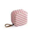 Cloth fabric cube-shaped makeup storage bag in blue, pink, white, and pink/white colour options.