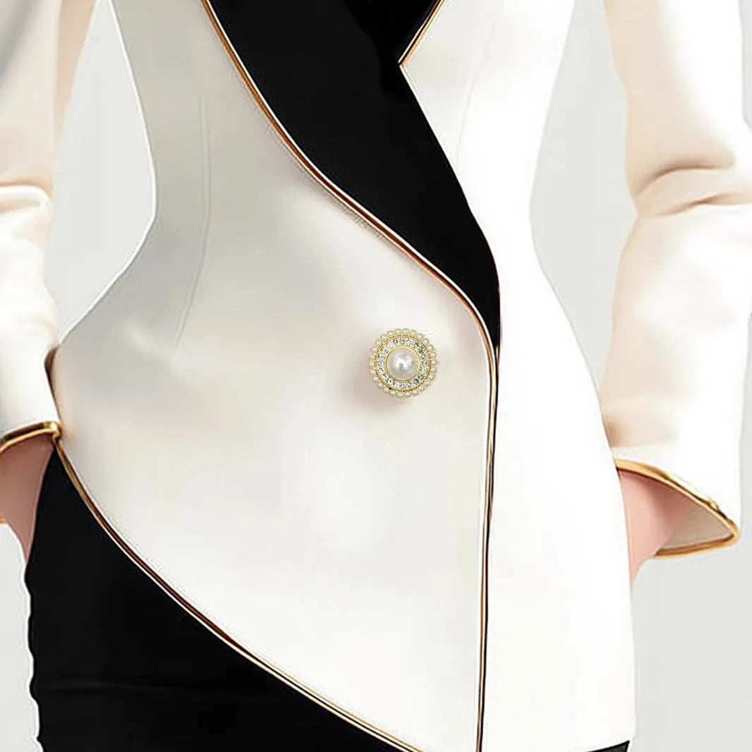 Beige women's irregular design long sleeve coat with golden edge pearl buttons on the front.