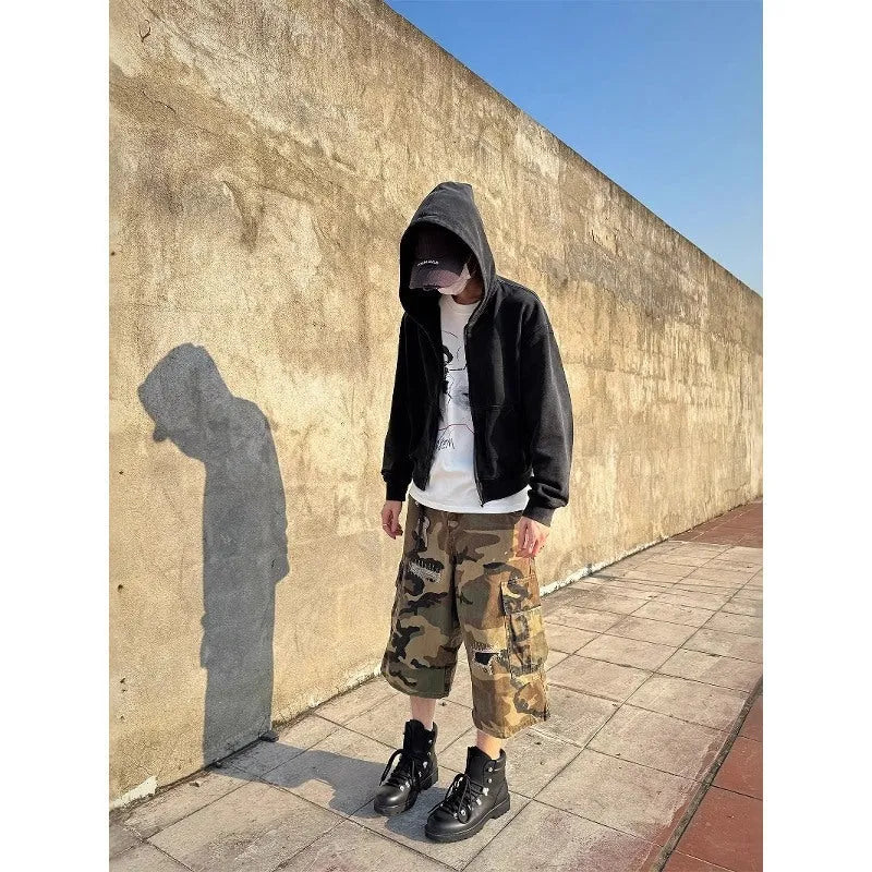 Men's camouflage cropped jeans with distressed patch detailing and straight-leg styling