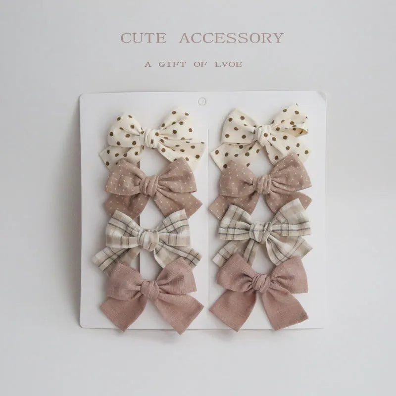 Children's cloth hairclips with dovetail bow decoration in multiple colour options