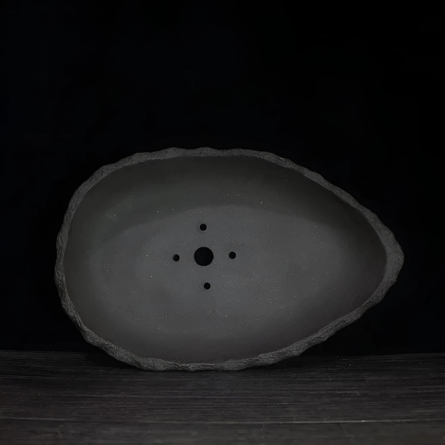 Handmade purple clay flower pot in various sizes and styles for indoor plants.