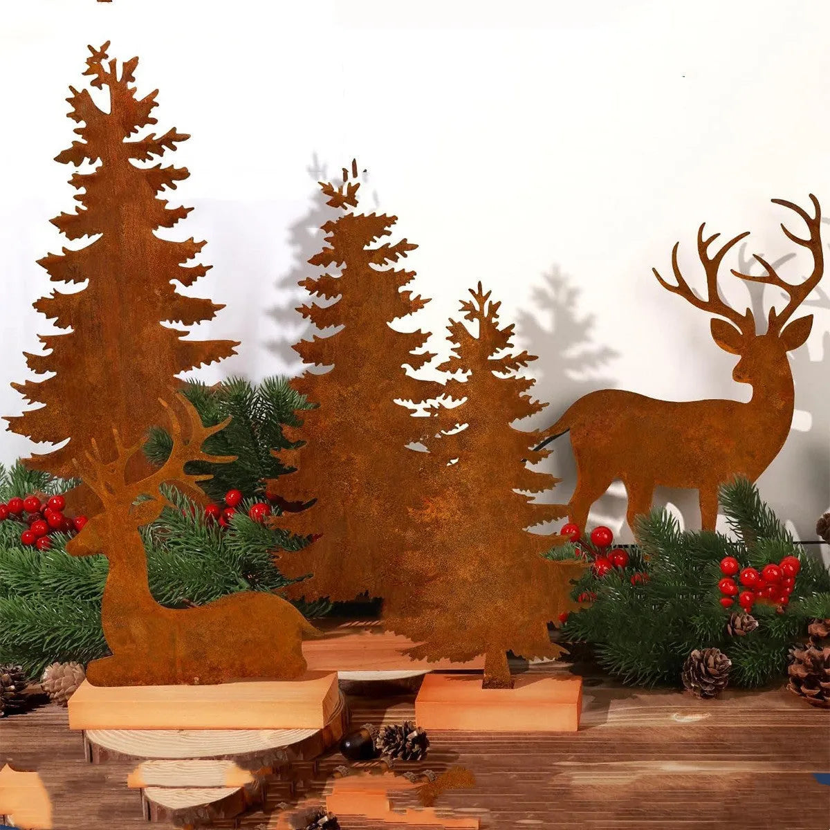 Set of three rustic iron Christmas tree and elk ornaments for holiday decor.