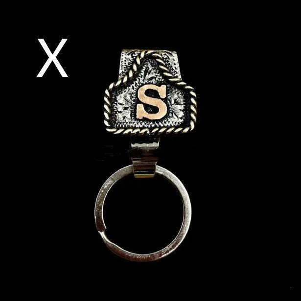 Handmade metal keychain with a cow tag charm in one of 26 available colour options.
