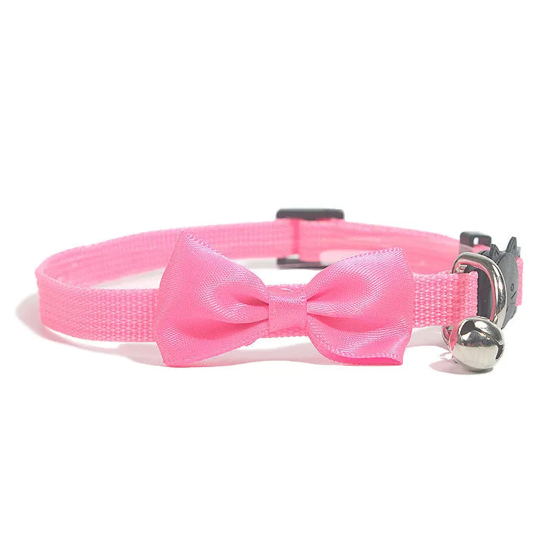 Adjustable striped nylon cat collar with a small bell, shown in multiple colour options on a white background.