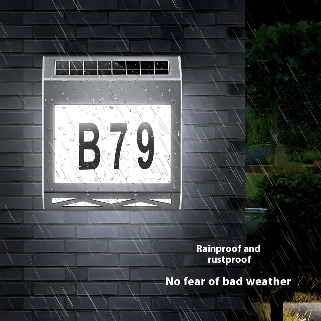 Black solar-powered metal doorplate light with LED house numbers and digital clock display