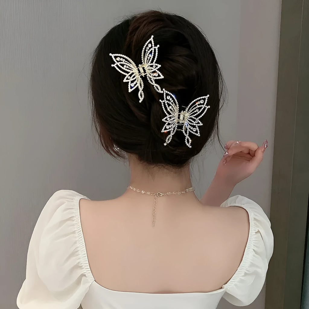 Butterfly-shaped hair clip for women in alloy metal with rhinestone or pearl decorative elements