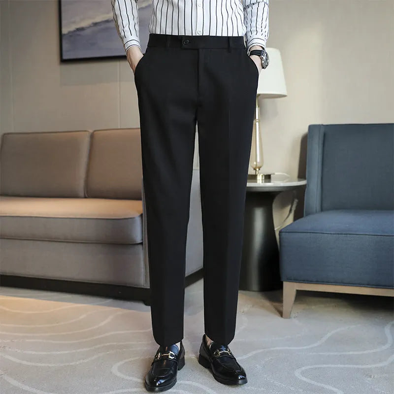 Retro brown straight leg corduroy trousers with elastic waistband laid flat.
