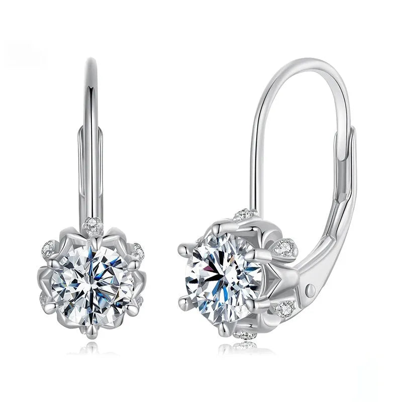 Sterling silver flower bud clip-on earrings with white gold plating and a central moissanite stone.