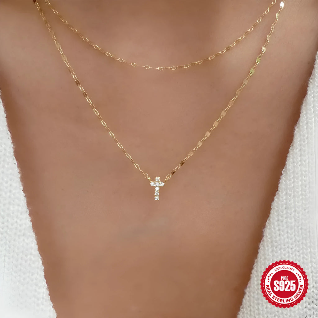 Double layer geometric twin diamond cross pendant on a sterling silver clavicle chain.