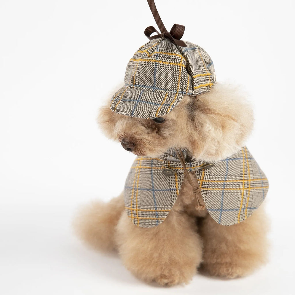 Camel-colour cotton detective cloak pet costume with adjustable hat on a small dog