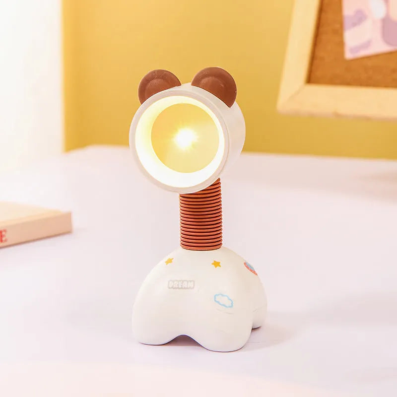 Cartoon animal magnetic night lamp with adjustable head on metallic surface