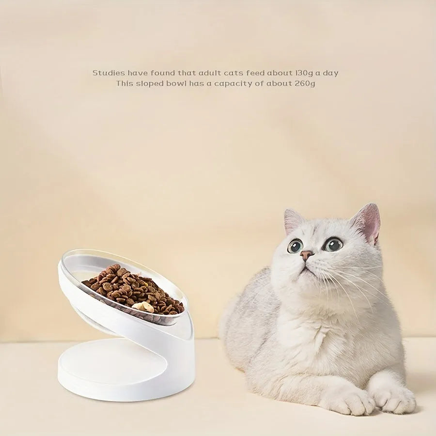 White clear plastic elevated cat food bowl with tilted anti-vomit design on a raised stand.