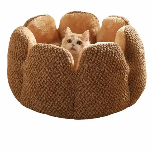 Green cactus petal shaped enclosed soft plush bed for a cat or small dog on a hardwood floor.