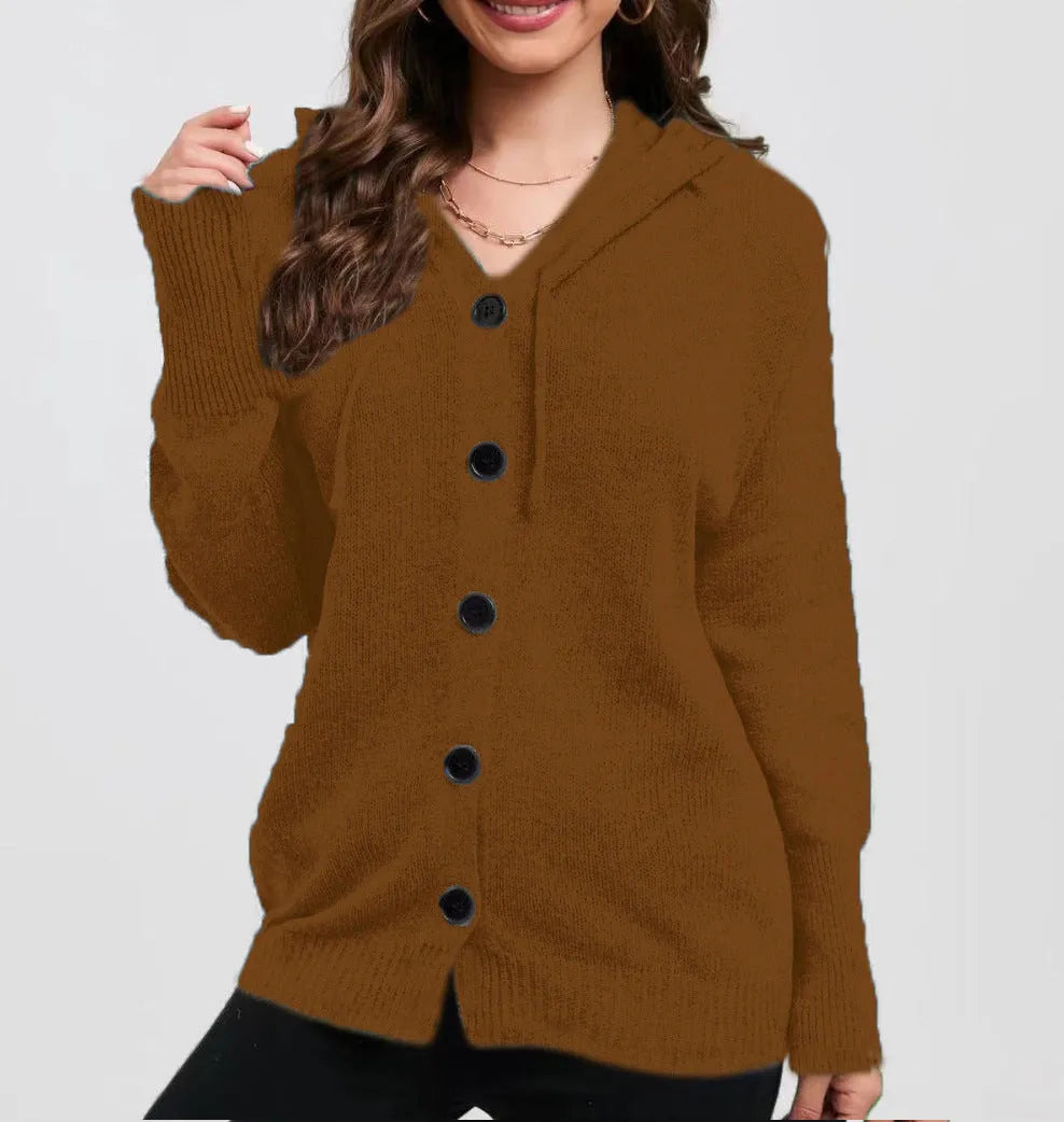 Woman wearing a loose fit, hooded, caramel-coloured cotton cardigan sweater with a textured pattern.
