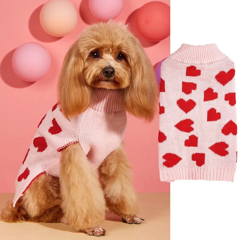 Dog wearing red love heart patterned sweater in acrylic knit fabric
