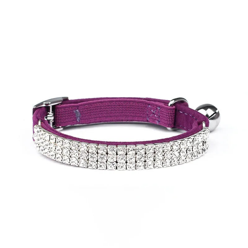 Rhinestone-studded velvet cat collar in assorted colours on a white background