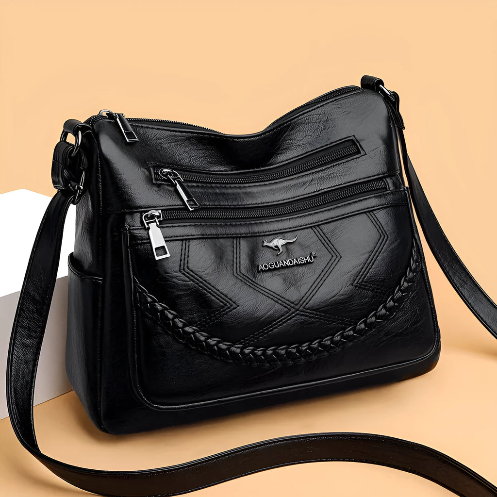 Women's black PU leather crossbody shoulder bag with large capacity and zipper compartment