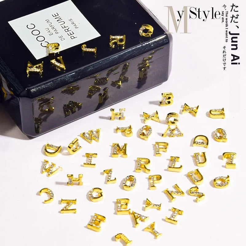Gold alloy letter A nail ornament charm with crystal detail on a square chain base