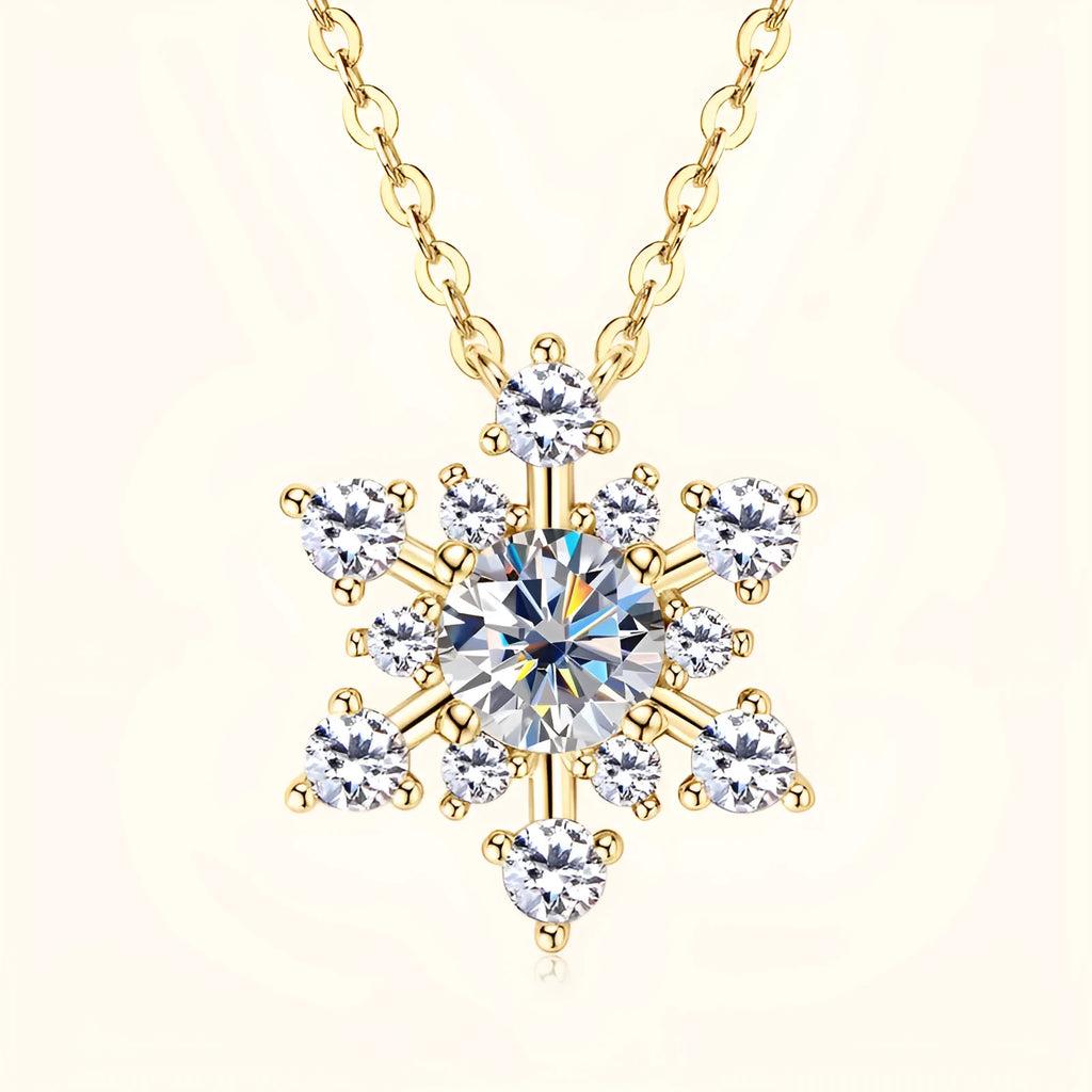 Gold snowflake moissanite pendant on silver 925 O-ring chain against white background