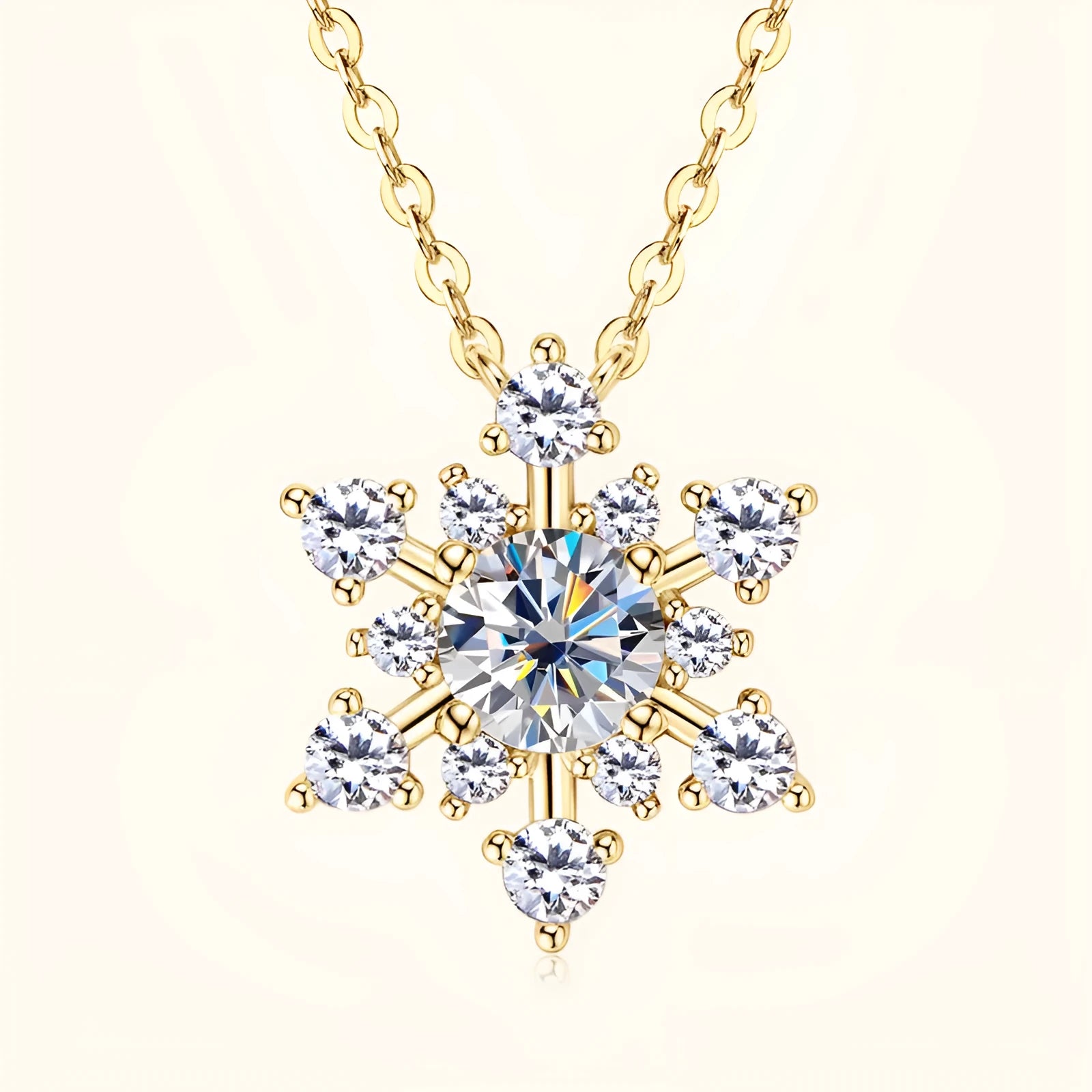Gold snowflake moissanite pendant on silver 925 O-ring chain against white background