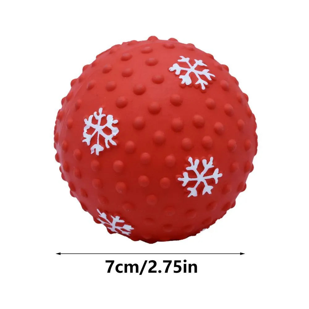 Red dog toy ball with squeaker and air vents, 7 cm diameter, floating on water