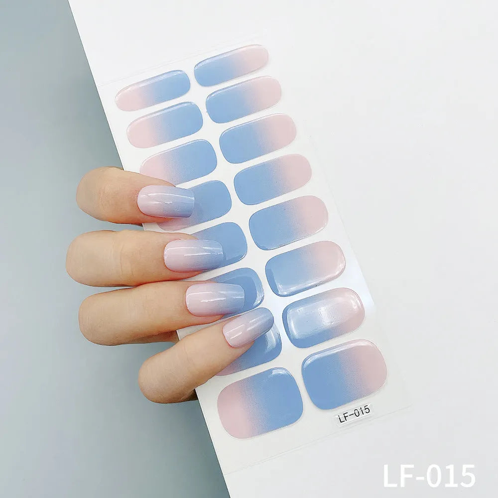 Set of 16 solid colour full nail art stickers showing patterns like cross, rose, tulip, and cartoon designs.