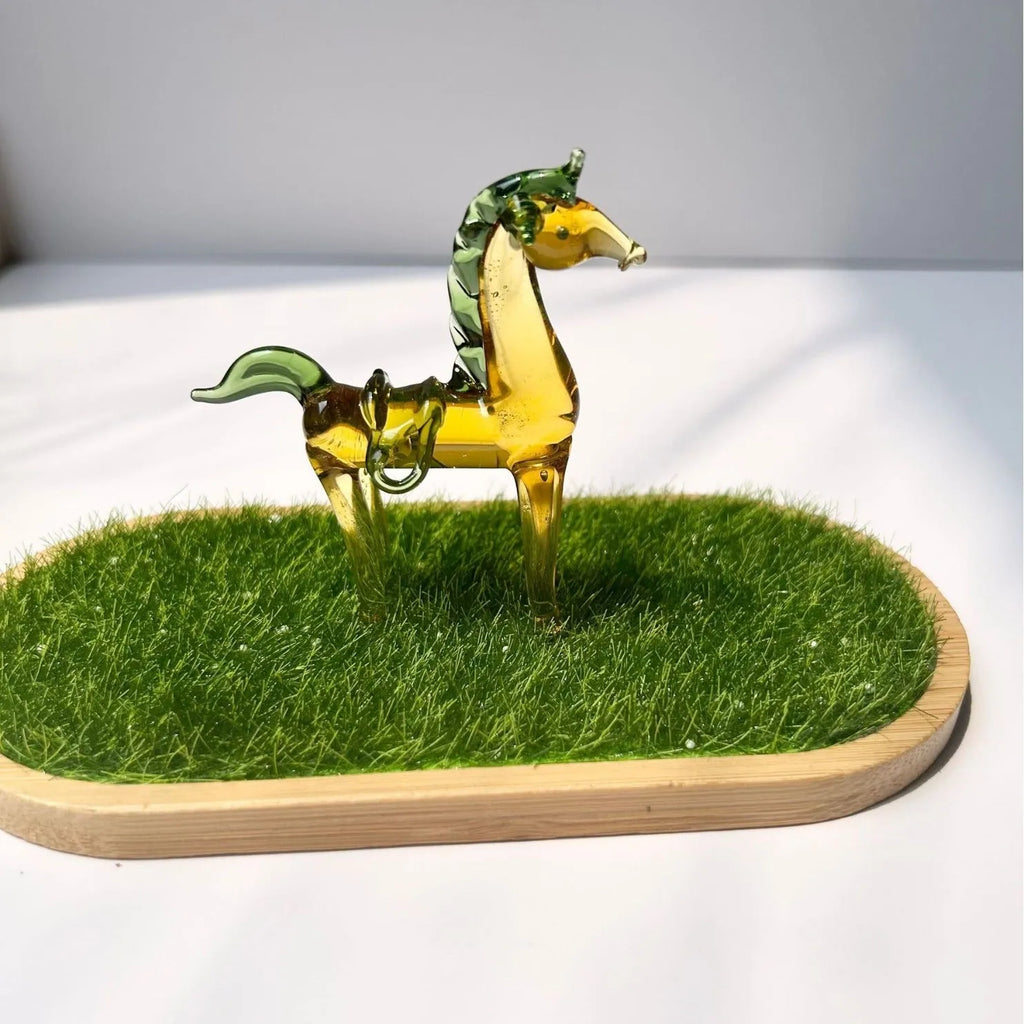 Brown glazed ceramic horse ornament on wooden shelf