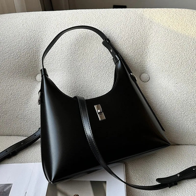 Genuine leather dumpling-shaped crossbody bag in apricot colour with an outer sandwich pocket