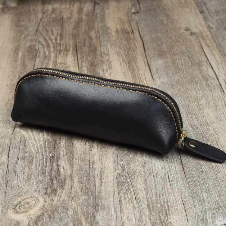 Square cowhide leather pencil case with zip closure measuring 18cm