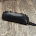 Square cowhide leather pencil case with zip closure measuring 18cm