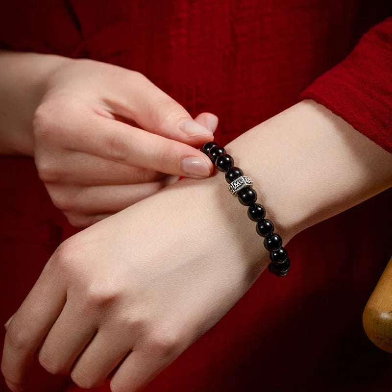 Obsidian zodiac bracelet with 8mm beads showing ethnic styling and traditional Chinese animal symbolism