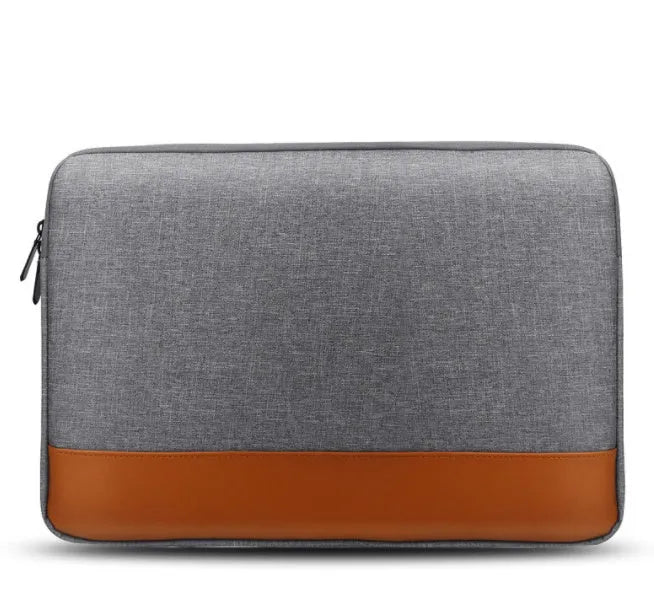 13-inch Oxford cloth tablet PC liner bag in grey with zip closure on a flat surface